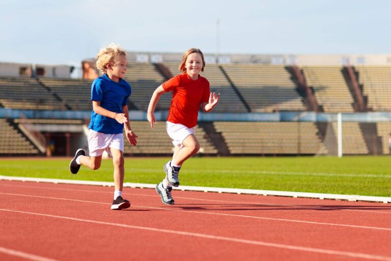 bigstock-Child-Running-In-Stadium-Kids-459322201-min